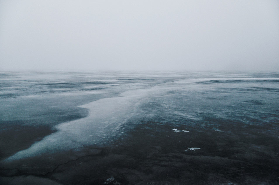Fine art photography of frozen Danish lake in misty weather, photo by Niels-Jacob Dandanell.